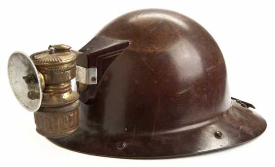 Color image of a rimmed miner's helmet worn by Adam Shapic circa 1910-1930s