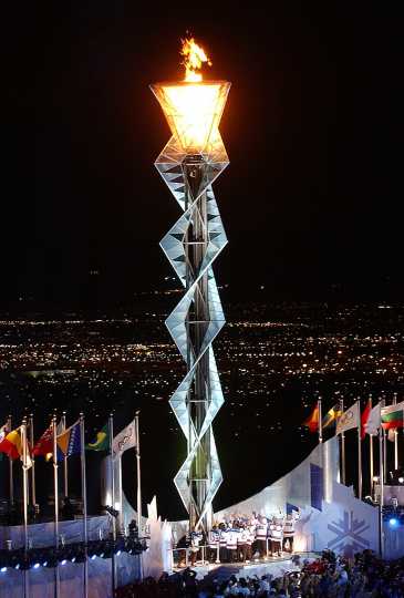 Color image of the 1980 Olympic U.S. Hockey team lighting the cauldron at the 2002 Olympics in Salt Lake City, Utah. Photographed by Preston Keres on February 8, 2002.