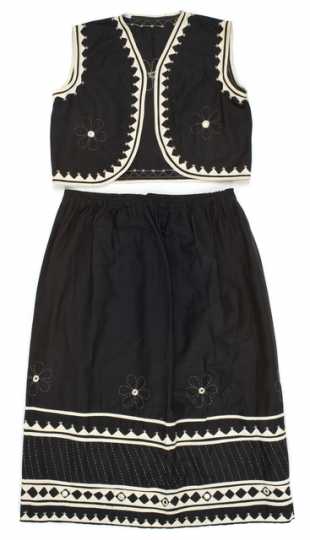 Color image of a child's black-and-white cotton vest and skirt made in India, 1967.