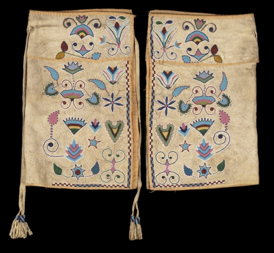 Color image of a pair of beaded Dakota-Metis half leggings, probably from the Red River region of North Dakota, Minnesota, and Manitoba, made in the mid 1800s