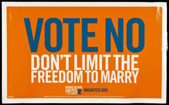 Color image of a cardboard lawn sign distributed by Minnesotans United for All Families in opposition to the Minnesota Marriage Amendment, proposed in 2012.