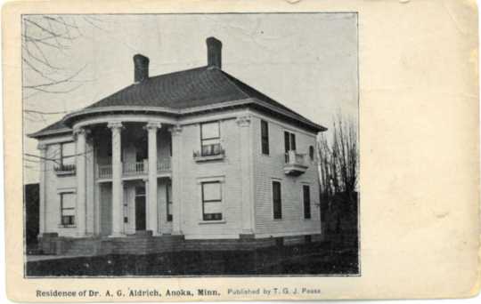 Postcard with image of Colonial Hall, residence of Drs. Alanson and Flora Aldrich. Photographer and date unknown; possibly taken shortly after the home was built in 1904. Used with the permission of the Anoka County Historical Society.