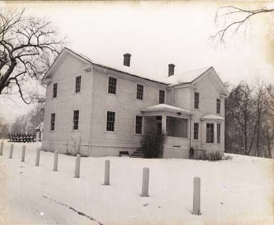 Black and white photograph of the southeast face of the Banfill Tavern–Locke House, 1978.