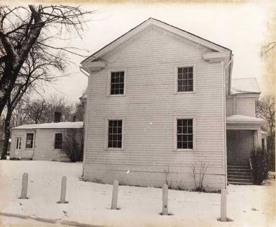 Black and white photograph of the south face of the Banfill Tavern–Locke House showing 1852 addition, 1978.