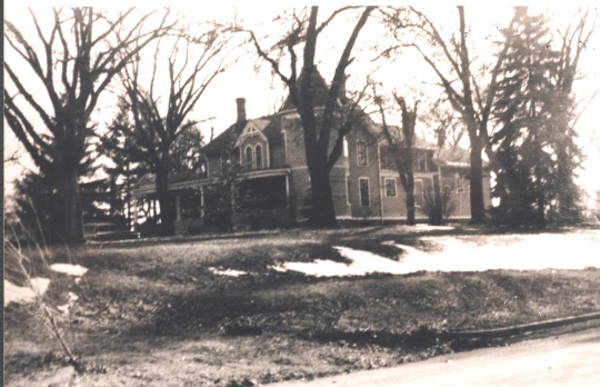 Photograph of the Ticknor House taken in 1972. Interior renovations in 1938 had turned the house into three separate apartments, and divided up and sold much of the Ticknor property that formerly took up the whole block. No further extensive renovations were made until after the house was sold out of the Ticknor family in 1977. Photographer unknown. Anoka County Historical Society, object ID# 3000.3.66.