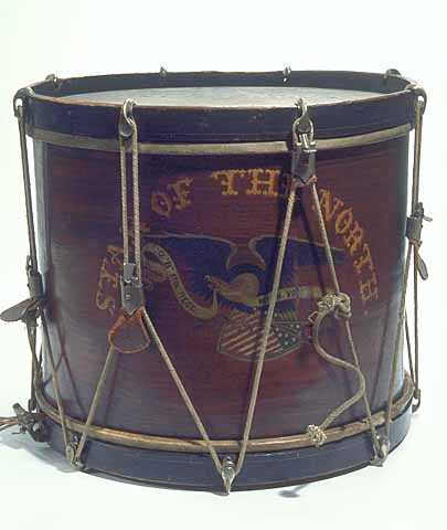 Image of hand-painted drum composed of a walnut-stained wood shell and black hoops with rope tuning cords. 