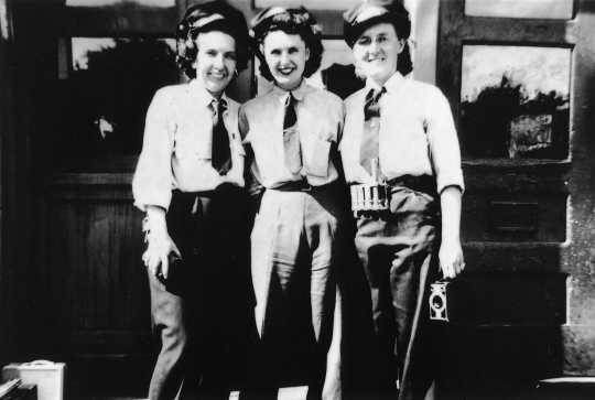 photograph of three uniformed motorettes