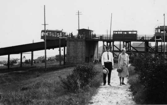 A couple posed in front of the top of the Incline station