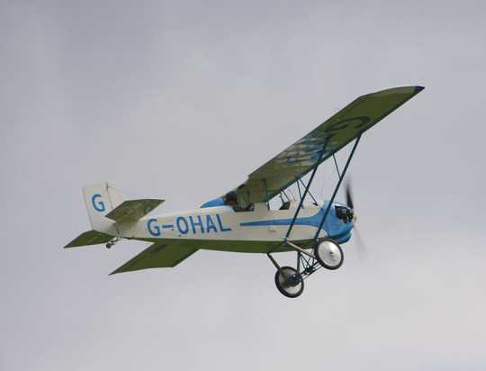 Color photograph of Pietenpol Air Camper G-OHAL, Continental C90-14F powered, built 2008, flying at Old Warden on September 7, 2008.