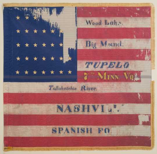 Tattered battle flag of the Seventh Minnesota Infantry Regiment. 
