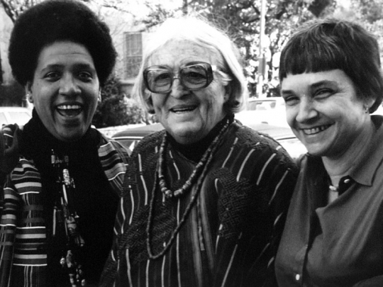 Black and white photograph of left to right: Audre Lorde, Meridel Le Sueur, and Adrienne Rich, c.1980.