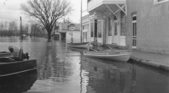 Black and white photograph of flood at Chaska, 1965. Photographed by Les Melchert.