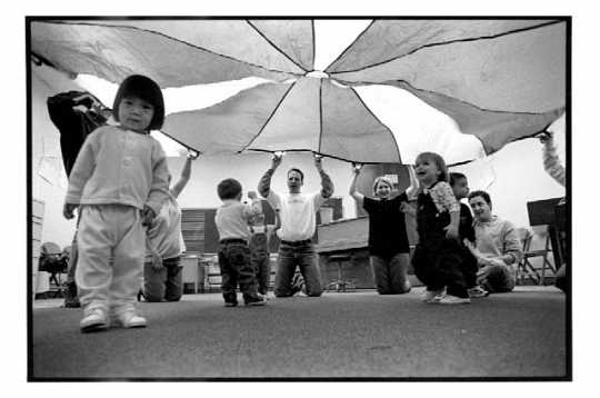 "Music for Creepers & Toddlers" class. Photograph by George Byron Griffiths, April 24, 1999. The early childhood music education class for parents and their nine-to-twenty-three-month-old children was held at the MacPhail Center for the Arts in Minneapolis.