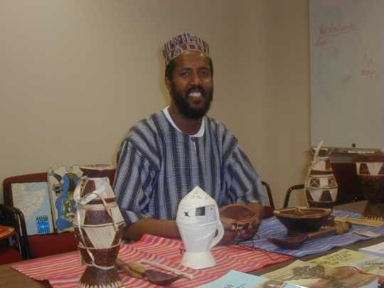 Photograph of St. Paul ESL teacher Abdisalam Adam in his office, June 24, 2004.