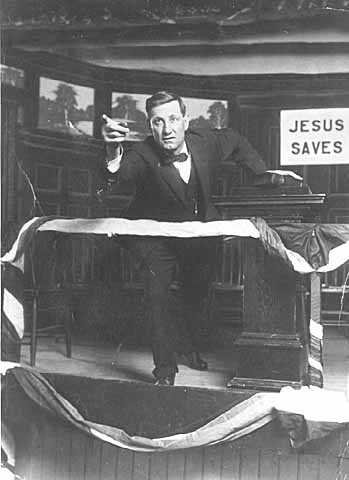 Photograph of Reverend John Sornberger, a lumberjack sky pilot, preaching c.1930.