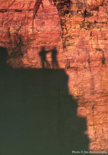 Color image showing shadows of visitors to Blue Mounds Quarry, 1995.