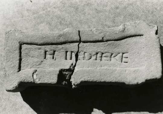 Black and white photograph  of a brick manufactured at the Imdieke brick yard between 1883 and 1915 in Meire Grove.