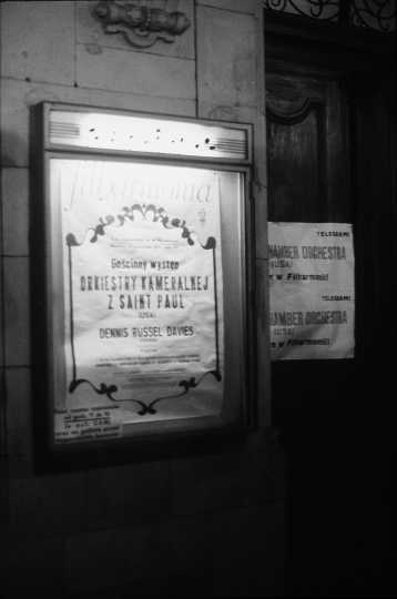Black and white photograph showing an advertisement for the SPCO’s international debut during a tour of Poland, Czechoslovakia, Yugoslavia, and Romania in 1974.