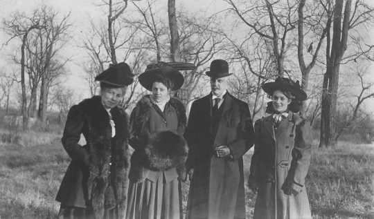 Black and white photograph of Ellsworth D. Childs with wife Eliza (far left) and two unidentified women, ca. 1890–1900.