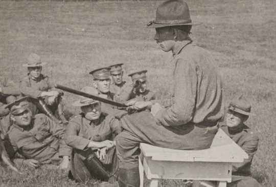 Black and white photograph of Colonel Bellows of the Minnesota National Guard giving instruction in riot stick usage. Camp Lakeview, Lake City, Minnesota, September, 1918. 