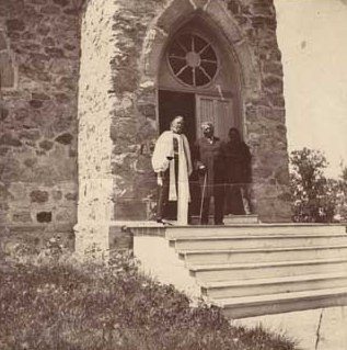 Black and white photograph of Enmegahbowh (Reverend John Johnson) and Bishop Whipple, c.1898.