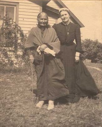 Black and white photograph of Sarah Good Thunder and Evangeline Whipple, ca. 1905.