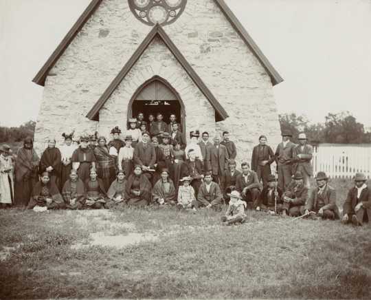Black and white photograph of Bishop Whipple and others at St. Cornelia's Church, Morton, c.1895.