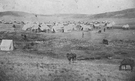 Black and white photograph of the camp of Brackett's Battalion near Fort Berthold, Dakota Territory, 1865.