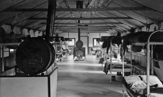 Black and white photograph of a barracks at the Cut Foot Sioux camp, F-14, CCC Company 707 at Dear River, ca. 1938.