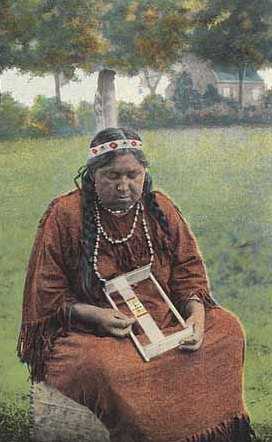 Colorized picture postcard featuring a Dakota woman making beadwork, c.1930.