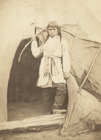 Black and white photograph of a Dakota boy at the concentration camp below Fort Snelling, 1863. Photograph by Whitney’s Gallery.