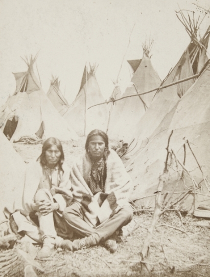 Black and white photograph of wo Dakota men at the Fort Snelling concentration camp, c.1862–1863. Photograph by Benjamin Franklin Upton.