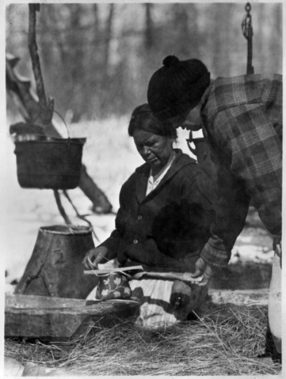 Um-be-quay (Mrs. John Mink) making maple sugar