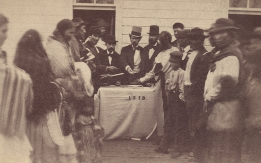Black and white photograph of annuities being paid at the Fond Du Lac reservation, c.1865.