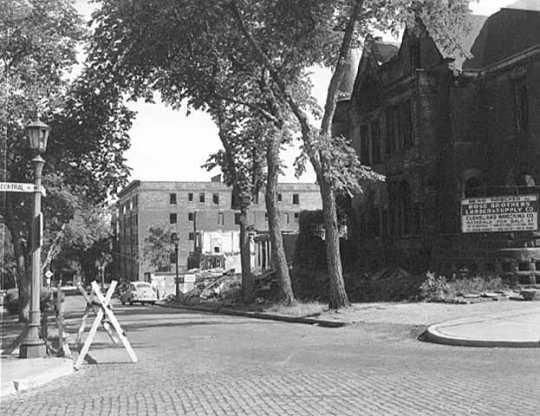 Black and white photograph of St. Paul's Central Park, c.1956. Its view looks south along Central Park Place West; the former Blood mansion is in the foreground.