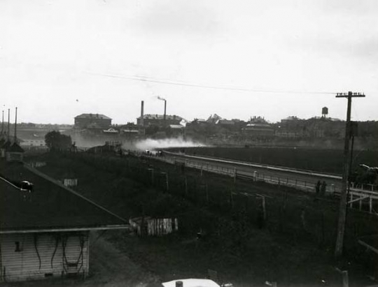 Black and white photograph of a auto race at the 1917 Minnesota State Fair. 