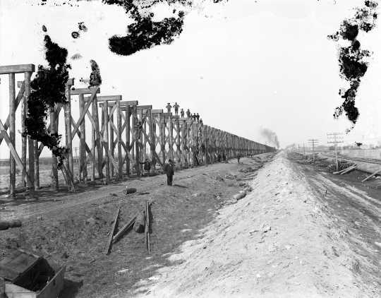 Black and white photograph of the Stockwood Fill trestle under construction. View to west, fall 1906.