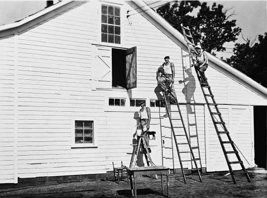 Black and white photograph of German prisoners of war painting a barn in Moorhead, ca. 1943–1945. Used with the permission of the Historical and Cultural Society of Clay County. 