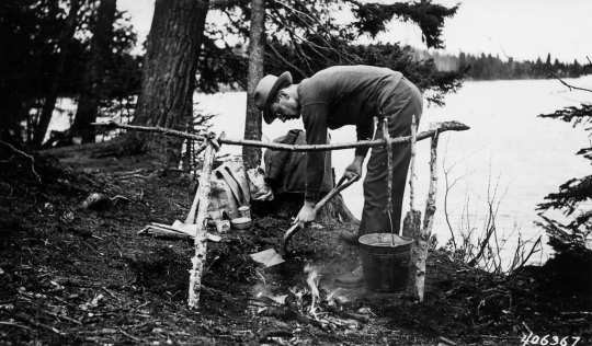 Forest Ranger demonstrating fire clean-up