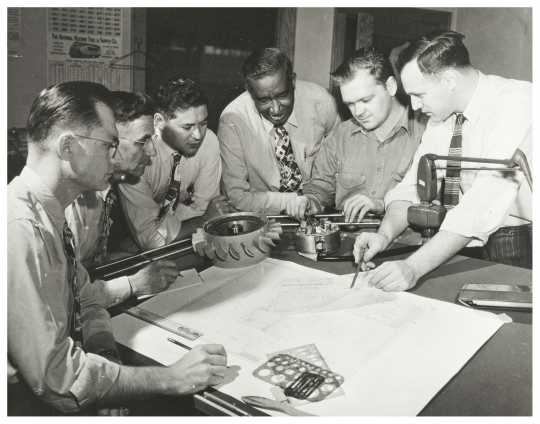 Black and white photograph of Frederick McKinley Jones and drafting team, c.1960.