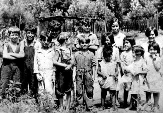 Black and white photograph of children in Swede Hollow, 1935.
