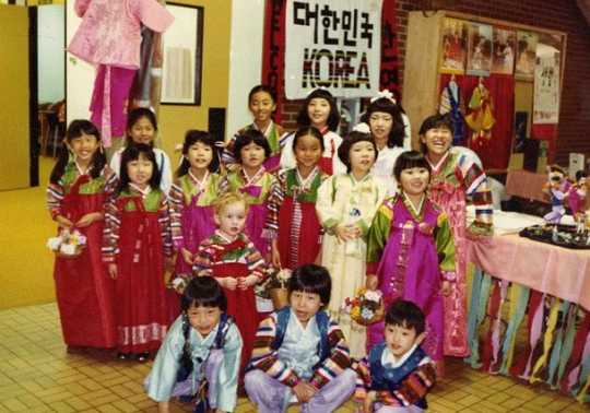 Color image of adopted Korean children in costume at Dual Heritage Conference, 1981.