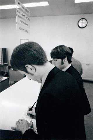 Black and white photograph of Jack Baker and James Michael McConnell applying for a marriage license in Minneapolis, 1970.