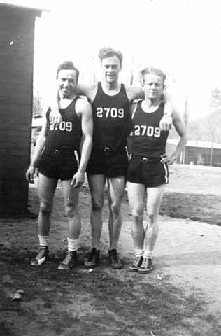 Black and white photograph of basketball players, Civilian Conservation Corps Company 2709, Whitewater State Park. Left to right: Joe Lewis, Frederick K. Johnson, and Carl Lund, 1935.