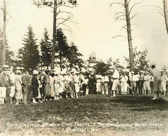 Photograph of an exhibition golf match between Wilford "Captain Billy" Fawcett and American champion Walter Hagen at Breezy Point Resort, 1926.