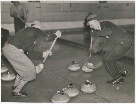 A curling game, 1937. Curling was introduced to Minnesota in the 1850s. Shown is action ca. 1935.