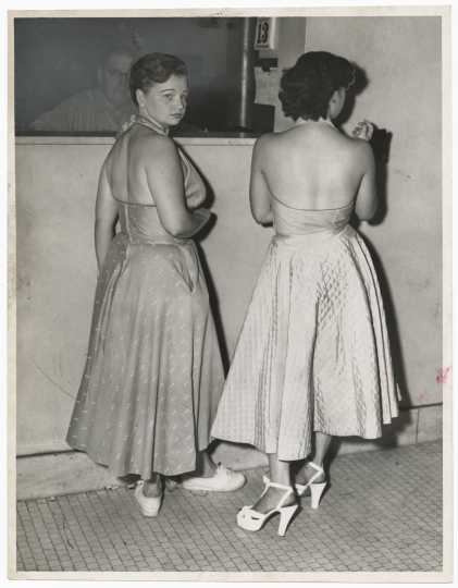 Gloria Jordell (left) and Phyllis Bennett (right) being booked on morals charges in Minneapolis, August 13, 1952. Minneapolis Star Tribune portraits collection, box 38.