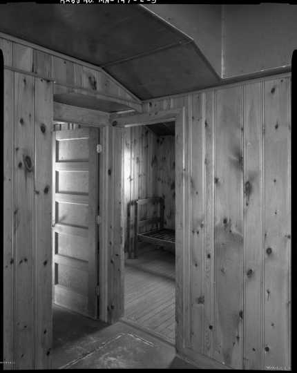 Interior view of the army officer’s quarters (Building 13), CCC Camp Rabideau F-50. Photo by Jerry Mathiason, 1994. From box 1 (144.G.8.4F) of Historic American Buildings Survey records related to Minnesota structures, 1882-2001, 1883. Manuscripts Collection, Minnesota Historical Society, St. Paul.