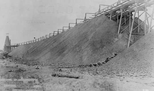 Black and white photograph of a stockpile or iron ore at Deerwood on the Cuyuna Iron Range, c.1918. 