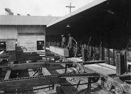Black and white photograph of lumber milling equipment, St. Paul branch of the Weyerhaeuser Company, ca. 1935.